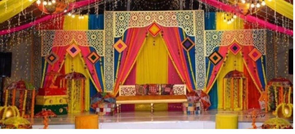 Colourful mehndi stage decor